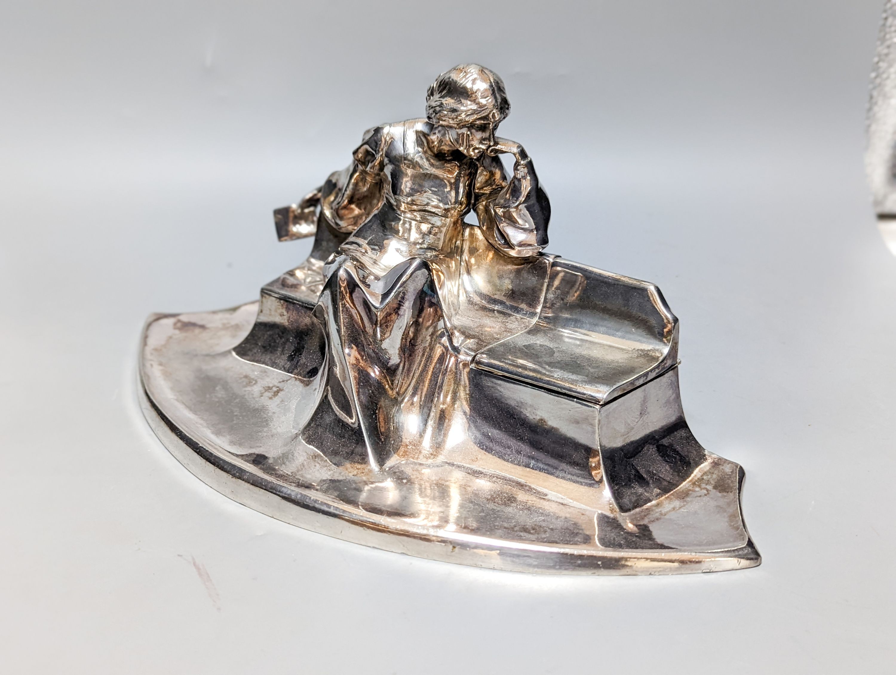 A WMF pewter teapot, an early 20th century bronze of Venus with dolphin, 2 other figures and a WMF style figural desk stand 36cm